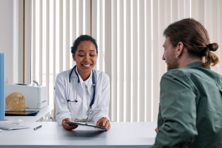 A man in a consultation with a clinician