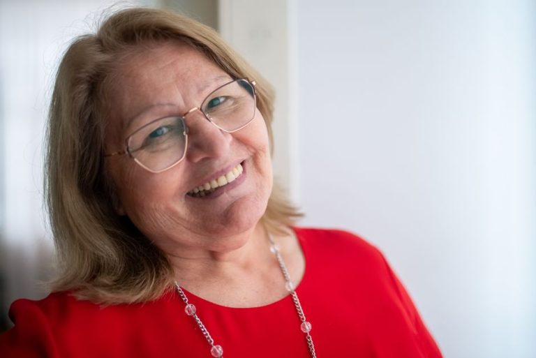 A smiling woman in her fifties
