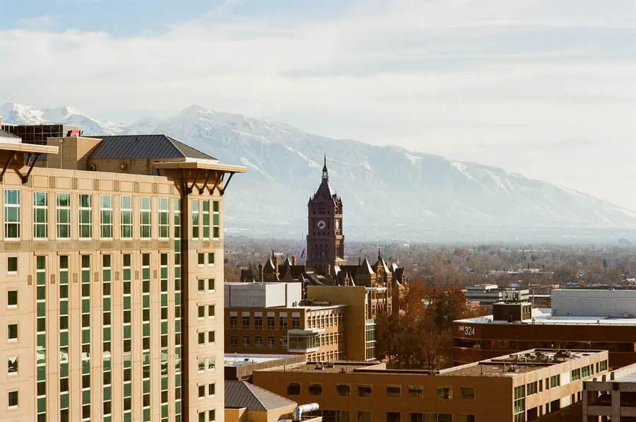 Salt Lake City buildings with the Wasatch mountains behind them