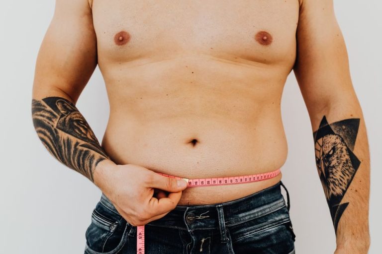A man measuring his waist