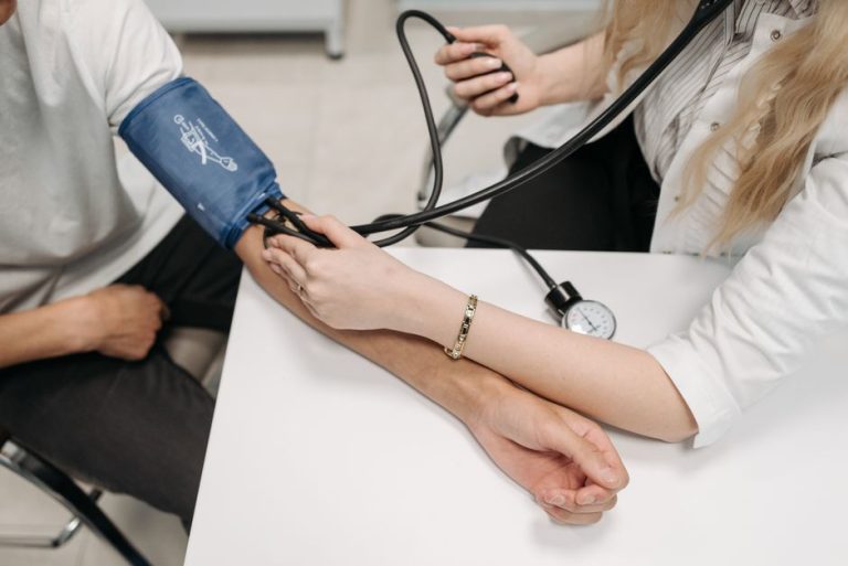 A blood pressure reading being taken